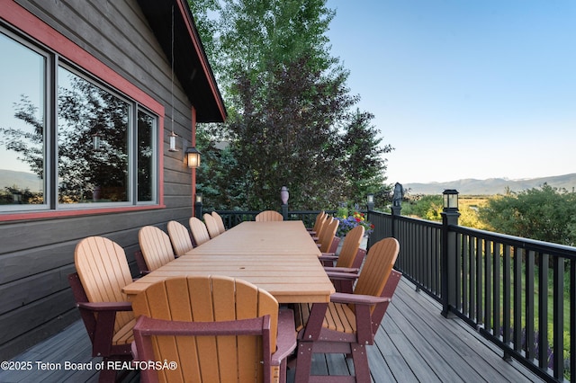 4053 S Adams Rd, Driggs, ID 83422 - wooden deck with outdoor dining space and a mountain view