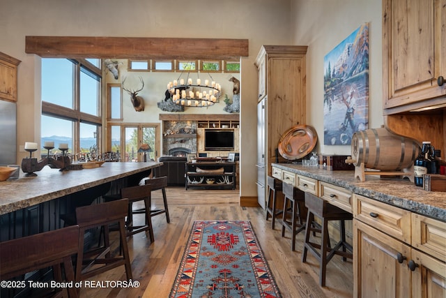 4053 S Adams Rd, Driggs, ID 83422 - dining space featuring light wood-style floors and a chandelier