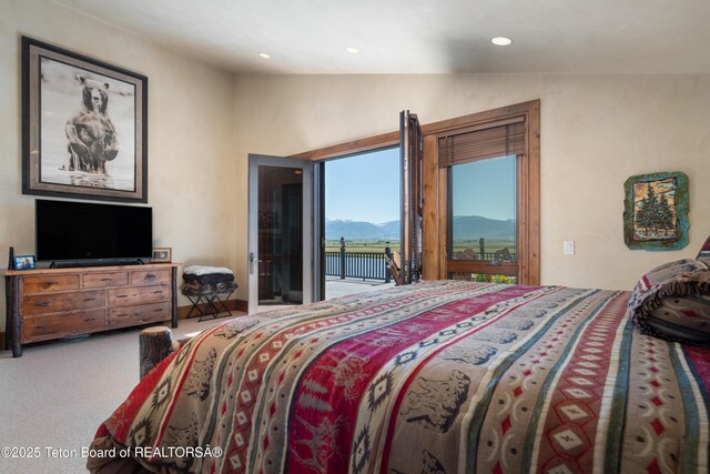 4053 S Adams Rd, Driggs, ID 83422 - bedroom with access to outside, a mountain view, vaulted ceiling, carpet, and recessed lighting