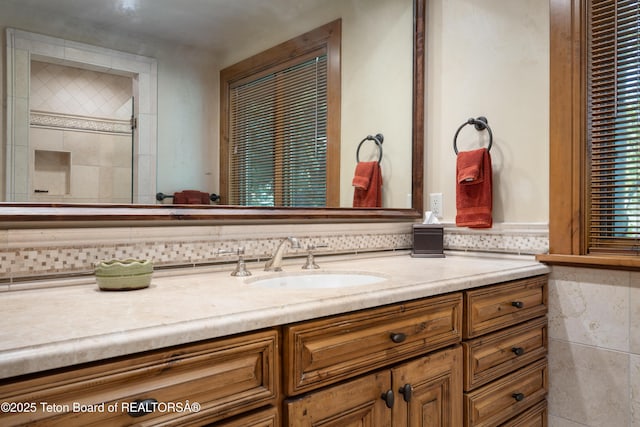 4053 S Adams Rd, Driggs, ID 83422 - full bathroom featuring vanity, backsplash, and tiled shower
