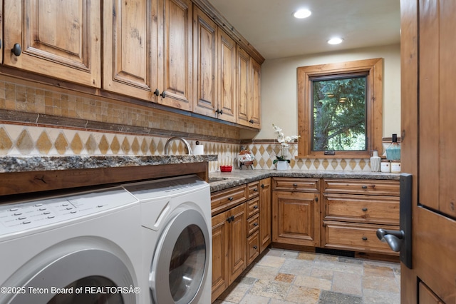 4053 S Adams Rd, Driggs, ID 83422 - washroom with washing machine and clothes dryer, cabinet space, recessed lighting, and stone tile flooring