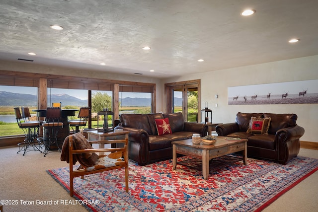 4053 S Adams Rd, Driggs, ID 83422 - carpeted living room with recessed lighting and a mountain view