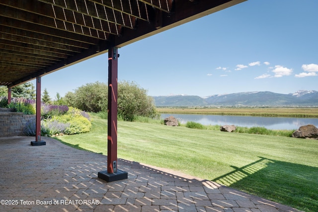 4053 S Adams Rd, Driggs, ID 83422 - view of patio / terrace with a water and mountain view