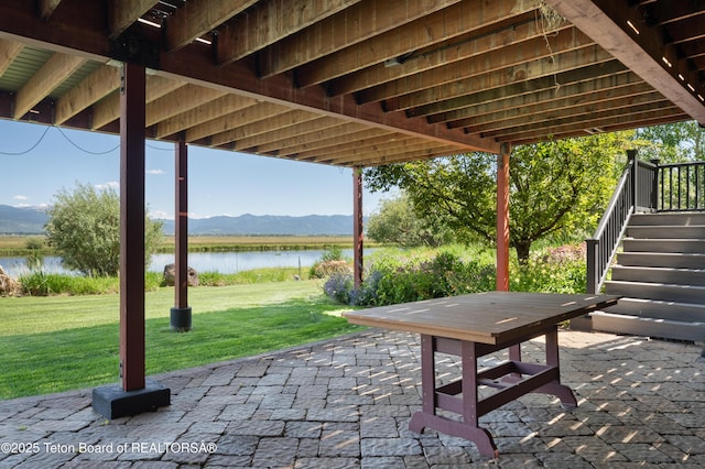 4053 S Adams Rd, Driggs, ID 83422 - view of patio / terrace with stairway and a water and mountain view