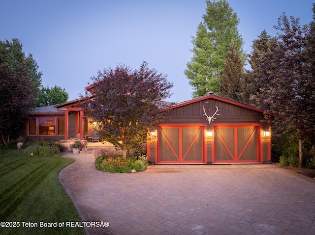 4053 S Adams Rd, Driggs, ID 83422 - view of front of house with decorative driveway, a garage, and a front yard
