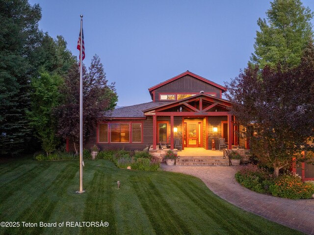 4053 S Adams Rd, Driggs, ID 83422 - back of house with a porch and a yard