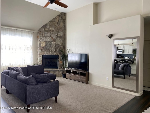 120 Baywood Dr, Driggs, ID 83422 - living area featuring a stone fireplace, a ceiling fan, baseboards, and lofted ceiling