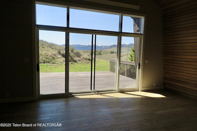 1710 E Porcupine Rd, Jackson, WY 83001 - doorway to outside with a mountain view and hardwood / wood-style flooring