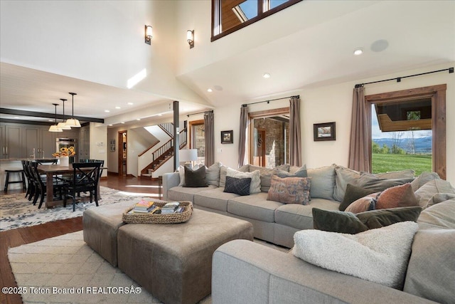 3375 W Killdeer Rd, Jackson, WY 83001 - living room with wood finished floors, stairway, a high ceiling, and recessed lighting