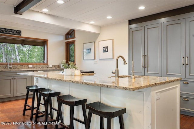 3375 W Killdeer Rd, Jackson, WY 83001 - kitchen with gray cabinets, a sink, beam ceiling, recessed lighting, and light wood finished floors