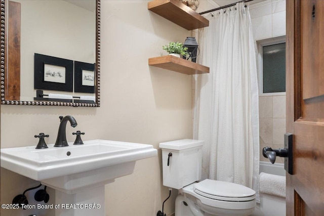 3375 W Killdeer Rd, Jackson, WY 83001 - full bath featuring toilet, a sink, and shower / bathtub combination with curtain