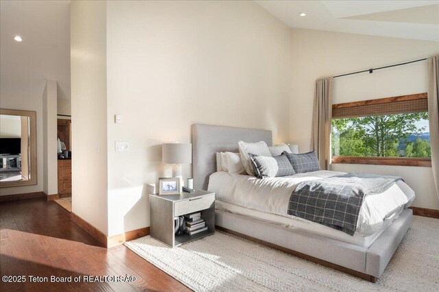 3375 W Killdeer Rd, Jackson, WY 83001 - bedroom featuring high vaulted ceiling, baseboards, wood finished floors, and recessed lighting