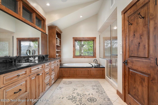 3375 W Killdeer Rd, Jackson, WY 83001 - bathroom with a garden tub, double vanity, tile patterned floors, vaulted ceiling, and a shower stall