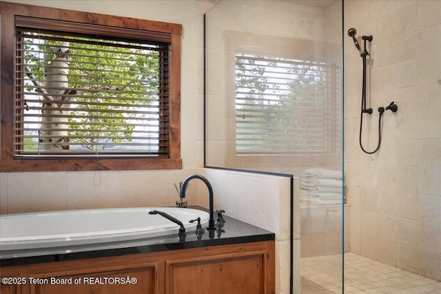 3375 W Killdeer Rd, Jackson, WY 83001 - bathroom with walk in shower, a garden tub, and plenty of natural light