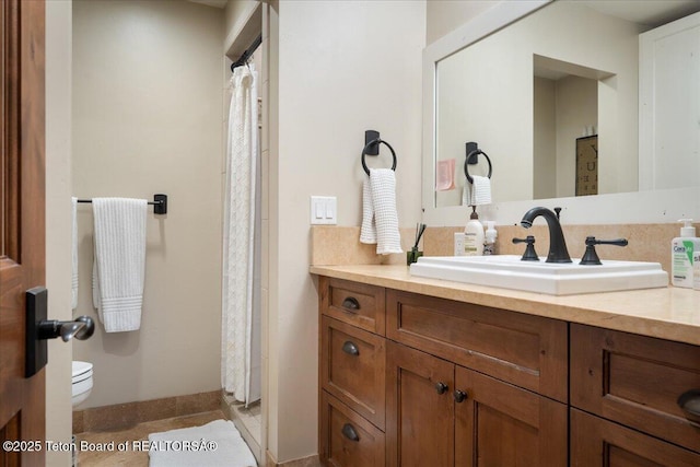 3375 W Killdeer Rd, Jackson, WY 83001 - bathroom with vanity, toilet, baseboards, and a shower with shower curtain