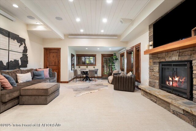 3375 W Killdeer Rd, Jackson, WY 83001 - carpeted living area featuring recessed lighting, a stone fireplace, wooden ceiling, and baseboards