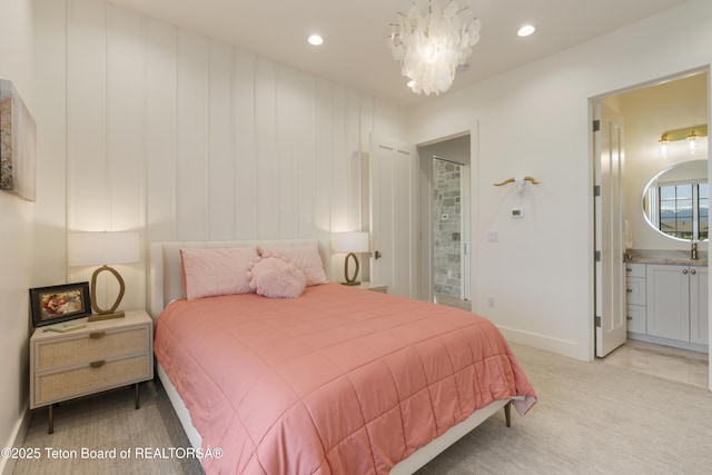 1070 Horseshoe Ln, Driggs, ID 83422 - bedroom featuring baseboards, a chandelier, recessed lighting, connected bathroom, and light colored carpet