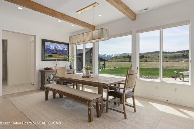 1070 Horseshoe Ln, Driggs, ID 83422 - dining room with beam ceiling, light wood-style floors, a mountain view, baseboards, and recessed lighting