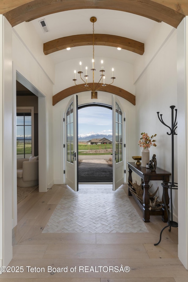 1070 Horseshoe Ln, Driggs, ID 83422 - foyer featuring a chandelier and parquet flooring