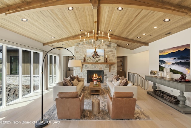 1070 Horseshoe Ln, Driggs, ID 83422 - living area featuring wood ceiling, recessed lighting, wood finished floors, a stone fireplace, and a chandelier