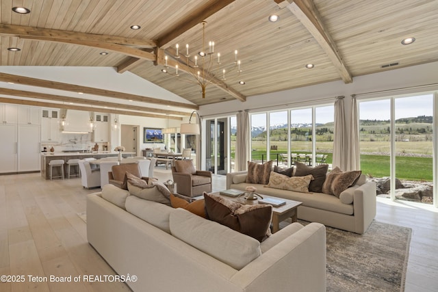 1070 Horseshoe Ln, Driggs, ID 83422 - living room featuring light wood-style floors, recessed lighting, plenty of natural light, wood ceiling, and a chandelier