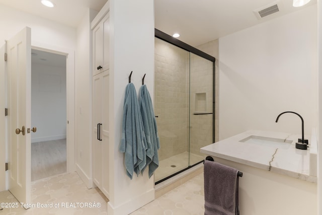 1070 Horseshoe Ln, Driggs, ID 83422 - bathroom with a stall shower, recessed lighting, and vanity