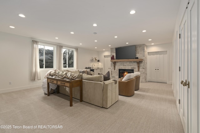 1070 Horseshoe Ln, Driggs, ID 83422 - living area with light colored carpet, a fireplace, recessed lighting, and baseboards