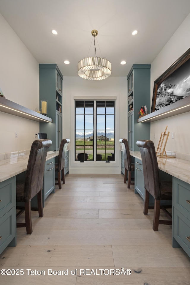 1070 Horseshoe Ln, Driggs, ID 83422 - home office featuring built in desk, light wood-style flooring, and recessed lighting