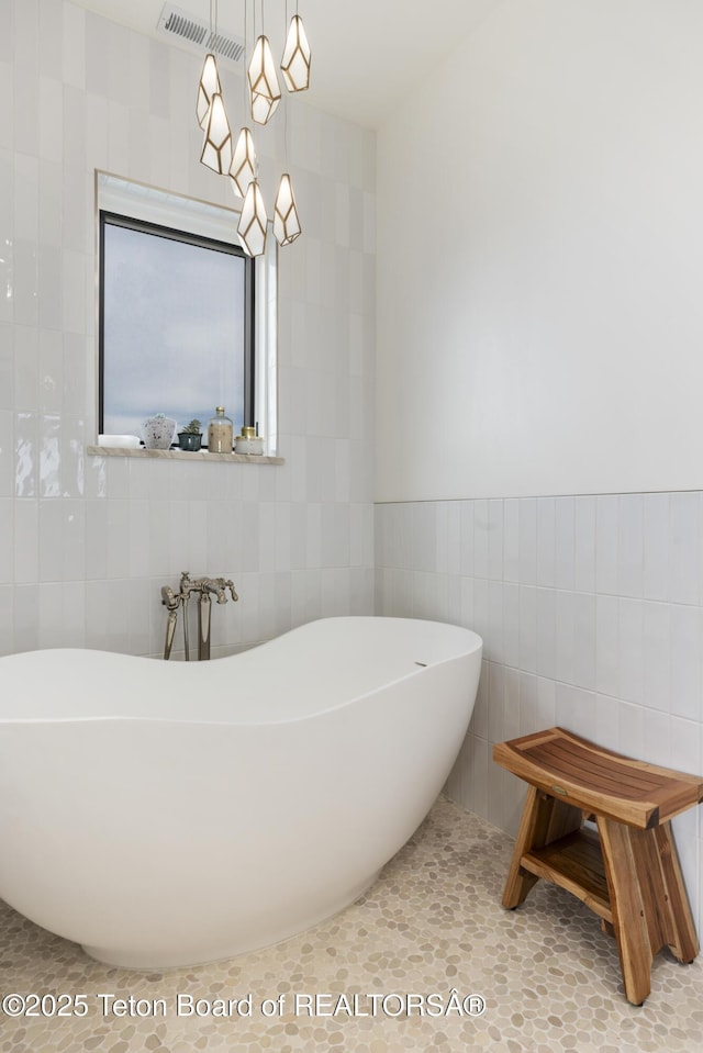 1070 Horseshoe Ln, Driggs, ID 83422 - full bath featuring tile walls and a soaking tub