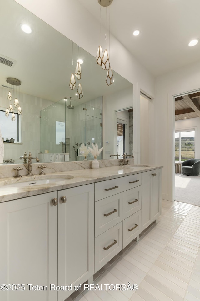 1070 Horseshoe Ln, Driggs, ID 83422 - full bath with a stall shower, double vanity, a chandelier, and recessed lighting