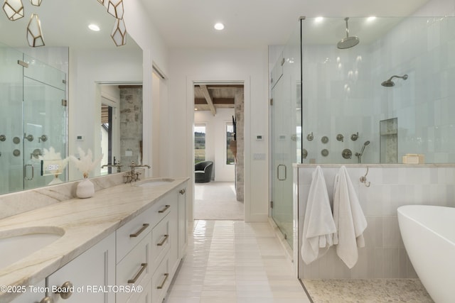 1070 Horseshoe Ln, Driggs, ID 83422 - ensuite bathroom with a stall shower, double vanity, a freestanding tub, beamed ceiling, and tile patterned flooring