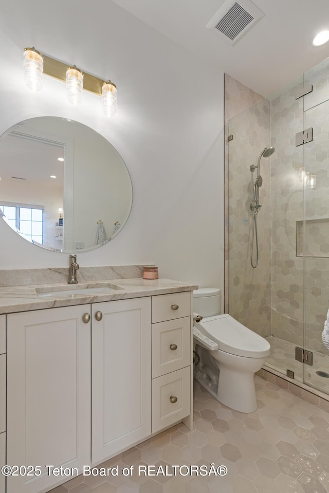 1070 Horseshoe Ln, Driggs, ID 83422 - full bath with toilet, a stall shower, tile patterned flooring, vanity, and recessed lighting