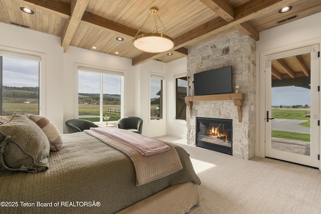 1070 Horseshoe Ln, Driggs, ID 83422 - carpeted bedroom with access to outside, wooden ceiling, beamed ceiling, a fireplace, and recessed lighting