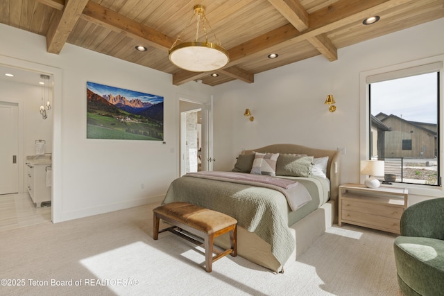 1070 Horseshoe Ln, Driggs, ID 83422 - carpeted bedroom with wooden ceiling, recessed lighting, beam ceiling, baseboards, and ensuite bathroom