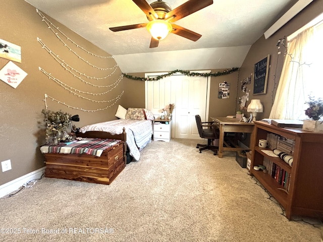 125 Wagon Rut Ln, Auburn, WY 83111 - bedroom featuring carpet floors, vaulted ceiling, an office area, a ceiling fan, and a textured ceiling