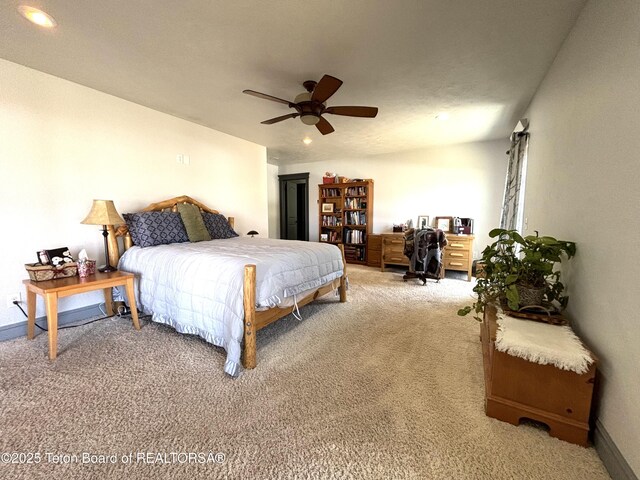 125 Wagon Rut Ln, Auburn, WY 83111 - bedroom with light carpet, recessed lighting, a ceiling fan, and baseboards