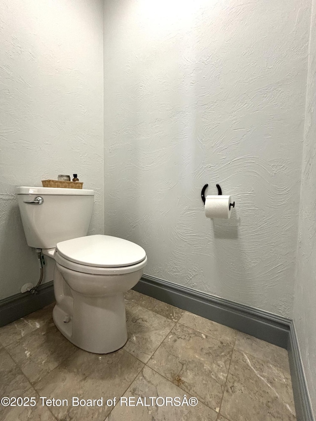 125 Wagon Rut Ln, Auburn, WY 83111 - bathroom featuring toilet and baseboards