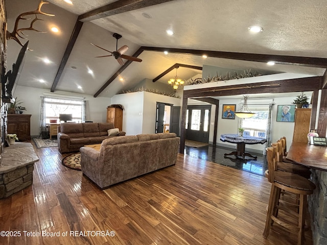 125 Wagon Rut Ln, Auburn, WY 83111 - living room with dark wood-style flooring, ceiling fan, a chandelier, and baseboards