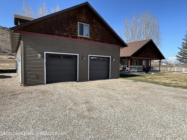125 Wagon Rut Ln, Auburn, WY 83111 - view of side of home with gravel driveway and a detached garage
