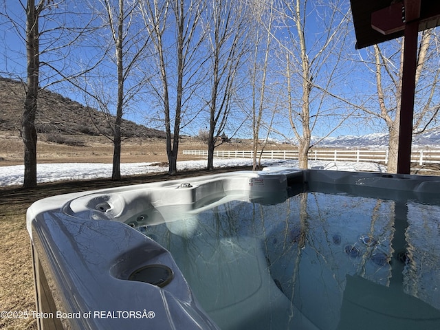 125 Wagon Rut Ln, Auburn, WY 83111 - exterior view of a mountain backdrop and a jacuzzi