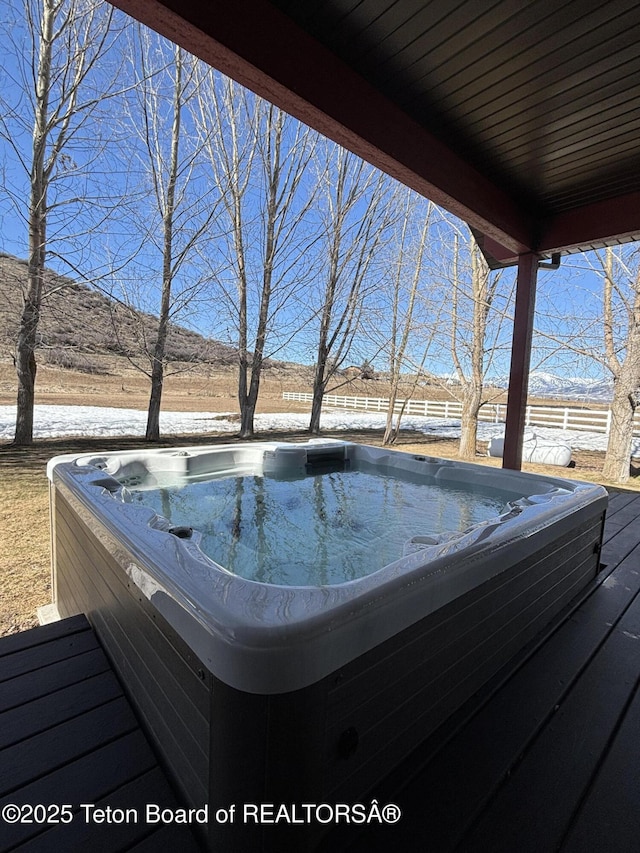 125 Wagon Rut Ln, Auburn, WY 83111 - wooden deck featuring a hot tub and a mountain view