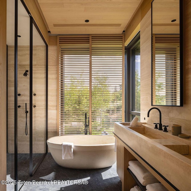 2205 W Pemmican Rd, Jackson, WY 83001 - bathroom with a soaking tub, vanity, wood ceiling, and a shower