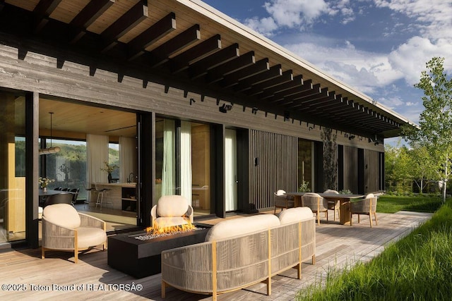 2205 W Pemmican Rd, Jackson, WY 83001 - view of patio / terrace with an outdoor fire pit and a deck