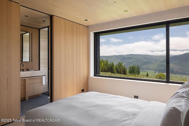 2205 W Pemmican Rd, Jackson, WY 83001 - bedroom with a mountain view and wood ceiling