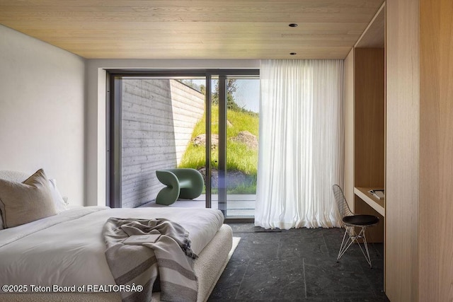 2205 W Pemmican Rd, Jackson, WY 83001 - bedroom featuring wood ceiling and access to outside