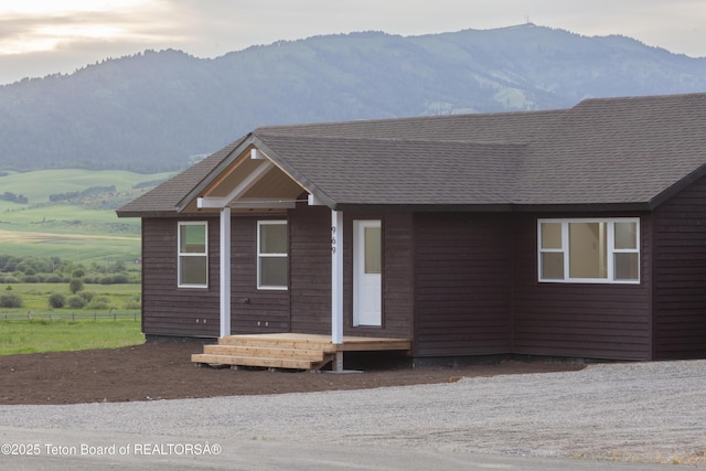 969 Caribou Peak Loop, Etna, WY 83118 - ranch-style house featuring a mountain view and roof with shingles
