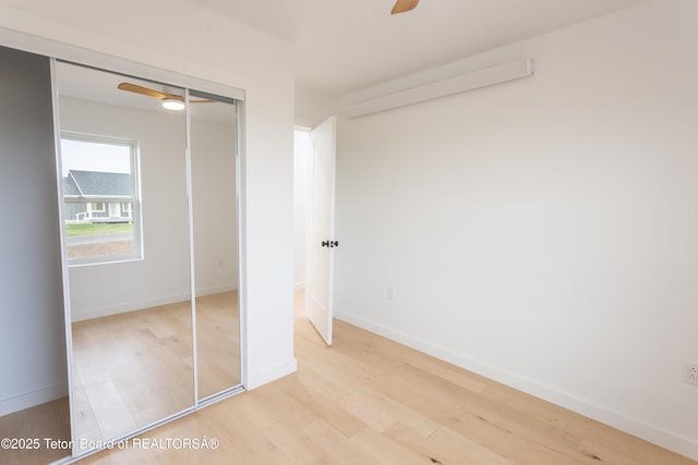 969 Caribou Peak Loop, Etna, WY 83118 - unfurnished bedroom with light wood-type flooring, a closet, and ceiling fan