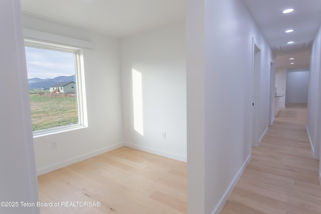 969 Caribou Peak Loop, Etna, WY 83118 - hall featuring light wood-style floors, recessed lighting, and a mountain view