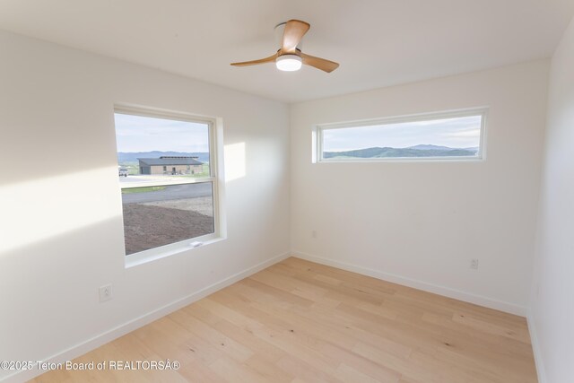 969 Caribou Peak Loop, Etna, WY 83118 - unfurnished room featuring wood finished floors and ceiling fan