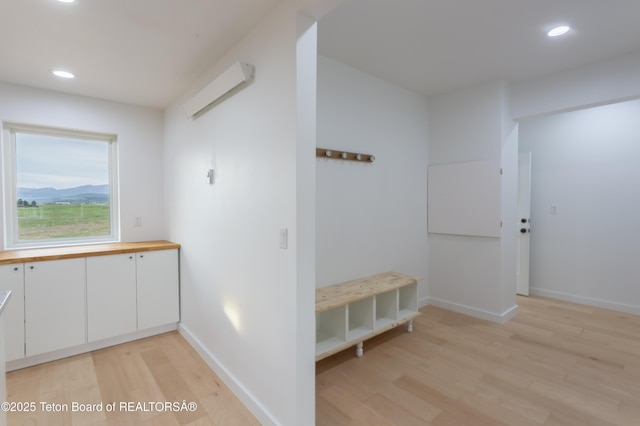 969 Caribou Peak Loop, Etna, WY 83118 - corridor with light wood finished floors and recessed lighting
